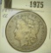 1975.           1890 CC Morgan Silver Dollar, VG.