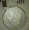 1977.           1893 CC Morgan Silver Dollar, Fine.