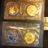 1390.           1972 S & 74 S Eisenhower Uncirculated Silver Dollars in original blue packs.