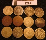 1714.           Interesting group of (12) Old Shield Nickels.