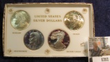 1757.           White Capital holder with Gold Lettering containing 1921 P Morgan Silver Dollar Gem