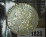 1828.           1886 P Morgan Silver Dollar, Almost Uncirculated.