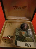 1865.           Pair of Sterling Silver Cuff Links in original box.  Each is embedded with four red