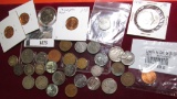 1875.           Mixed Group of Foreign and U.S. Coins. Includes several Silver pieces.