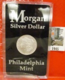 1945.           1878 7/8 tail feathers Morgan Silver Dollar, Stored in a holder from the Philadelphi