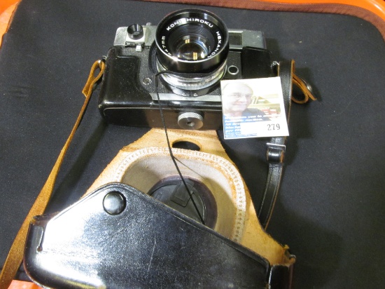 "Konica Auto S" 35mm Camera in original leather carry case with strap.