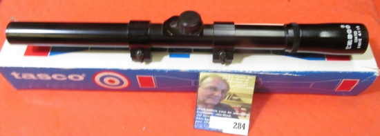 "Tasco 4 x 15" .22 cal Rifle Scope with original box and ring mounts.