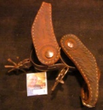 Pair of Hand forged and engraved Western Spurs. Little damage to the leather. Spurs work fine.