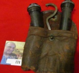 Anitque leather pouch with two ancient Shotgun Choke Tubes and a wrench.