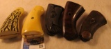 (5) Sets of Colt Revolver style grips. One set is Ivory, a couple plastic, and the last two are wood