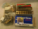 16 rounds of .308 brass; couple of Great Britain Mark III clips with .303 brass; bag of .308 boxer p