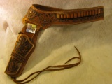 Approximately Size 34 Western Single Action Revolver Style left handed leather holster and belt. Exc