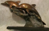 Cast Bronze Statue of a Pair of Dolphins Riding a Giant Wave.