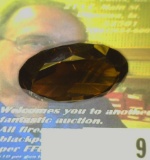 Oval faceted Precious Smokey Topaz weighing 47.12 carats and ready for mounting. Excellent color and
