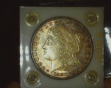 1880 S Morgan Dollar Nicely Toned BU In a 2X2 Capital Holder.