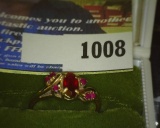 10K Gold Ladies Ring five Red Sets, which appear to be Rubies. Size 7. Weighs 2.5 grams. No box.