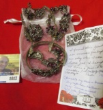 Earrings, Necklace, pair of Bracelets, and a Broach with Amethyst colored Stones. Note from Pamela H