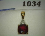 10K Gold Pendant with Garnet and Diamonds. Weighs 1.5 Grams.