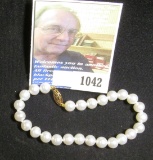 14K Gold clasp Ladies White Pearl Bracelet with 6.5-7mm Pearls. In retail bag priced at $160.00.