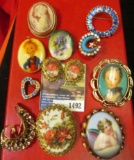 Group of old Broaches and a pair of clamp on Earrings.