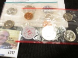 1964 P & D U.S. Mint Set in original cellophane and envelope as issued.
