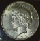 1935 P U.S. Peace Silver Dollar, Almost Uncirculated in a special holder.