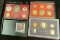 1973 S, 82 S, & 84 S U.S. Proof Sets in original holders as issued.