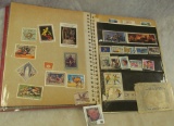 Stamp Collection in an old Photo Album, includes uncanceled as well as used and a few stickers.