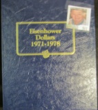 Nearly complete set of Eisenhower Dollars in a blue Whitman Deluxe Coin Album. Missing only the 1978