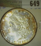 1880 P Brilliant Uncirculated Morgan Silver Dollar with attractive toning.