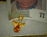 Angel Pendant with Citrine colored stone. In a Jewelry box.