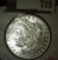 1888 Morgan Dollar, BU, value MS63 $65, MS65 $250