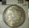 1890 Morgan Dollar, AU toned, value $45