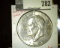 1973 Eisenhower Dollar, BU, from Mint Sets only, value $15