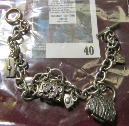 Sterling 8" charm bracelet with 6 purse / handbag charms, the 2 largest pieces are hinged and open,