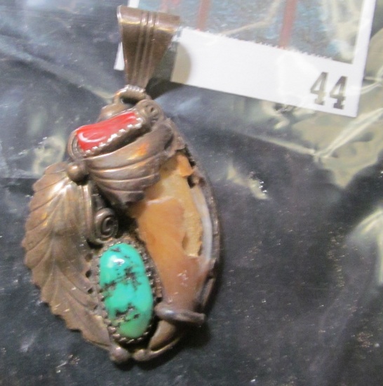 Vintage Native American sterling charm with a chipped bear claw, coral & turquoise, marked STERLING