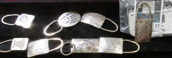 8 Native American silver keyrings, each is marked STERLING, some are marked with initials, one is si
