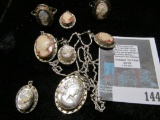 Group of silver and cameo jewelry, 2 sets, 1 orange background the other mother of pearl background,
