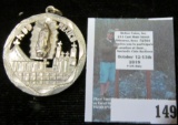 Handmade/folk art religious medallion, features the Virgin Mary floating above a cathedral square wi