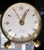 Gubelin (Swiss) 8 day, 15 jewel travel clock with alarm. Appears to be missing wind / set knobs on b