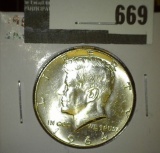 1964 Kennedy Half Dollar, BU blast white, value $15
