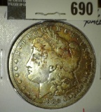 1880 Morgan Dollar, VG toned, value $30