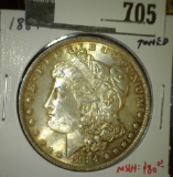 1884-O Morgan Dollar, BU toned, value MS64 $80, MS65 $165