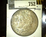 1904 Morgan Dollar, AU toned, value $55