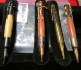 Group of 4 custom made hunting and rifle related inkpens, 3 feature hand-turned wooden barrels, one