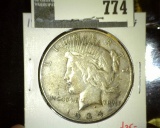 1934 Peace Dollar, VF/XF, value $35