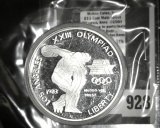 1983-S Los Angeles Olympiad Discus Thrower Commemorative Silver Dollar, Proof in capsule, value $30