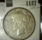 1927 D U.S. Peace Silver Dollar.