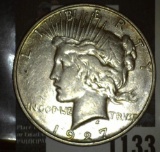1927 D U.S. Peace Silver Dollar.