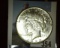 1927 P U.S. Silver Peace Dollar. A nice high grade.